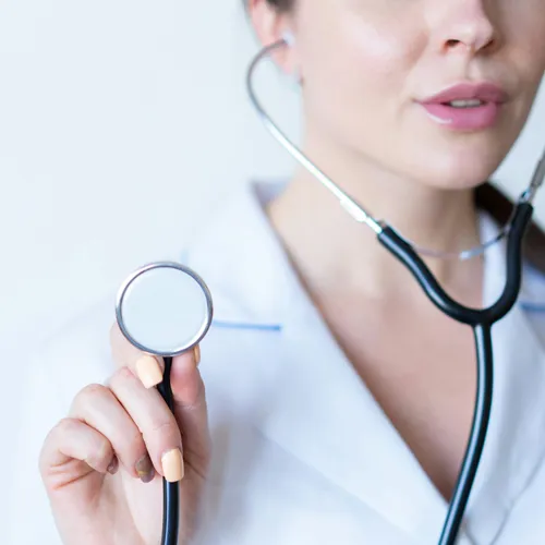 Female doctor in lab coat with a stethoscope.