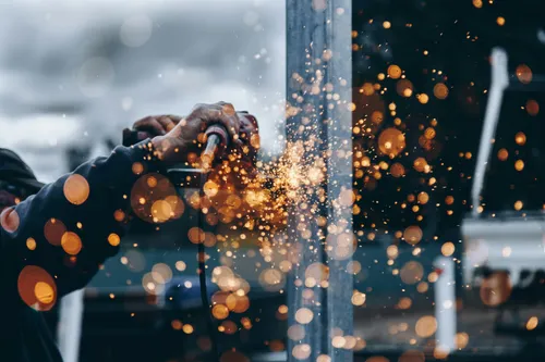 Person welding at a construction site.